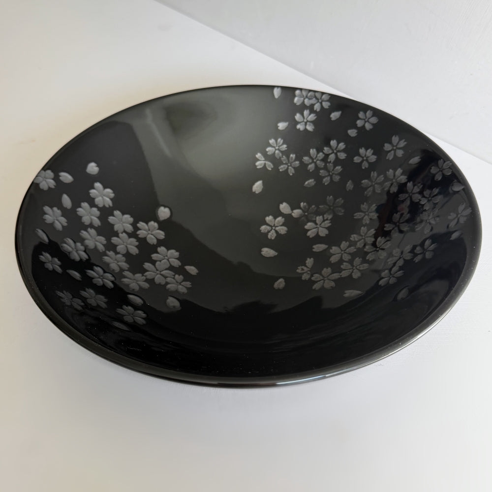Black Mino ware bowl with cherry blossom motifs, made in Japan. Available at Toka Ceramics.