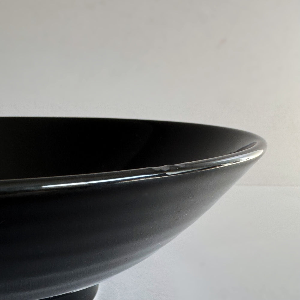 Black Mino ware bowl with cherry blossom motifs, made in Japan. Available at Toka Ceramics.