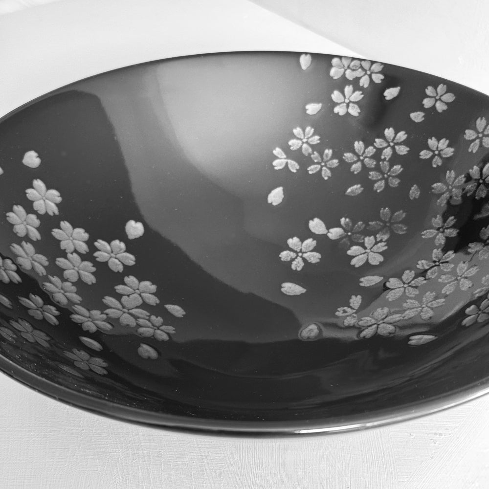 Black Mino ware bowl with cherry blossom motifs, made in Japan. Available at Toka Ceramics.