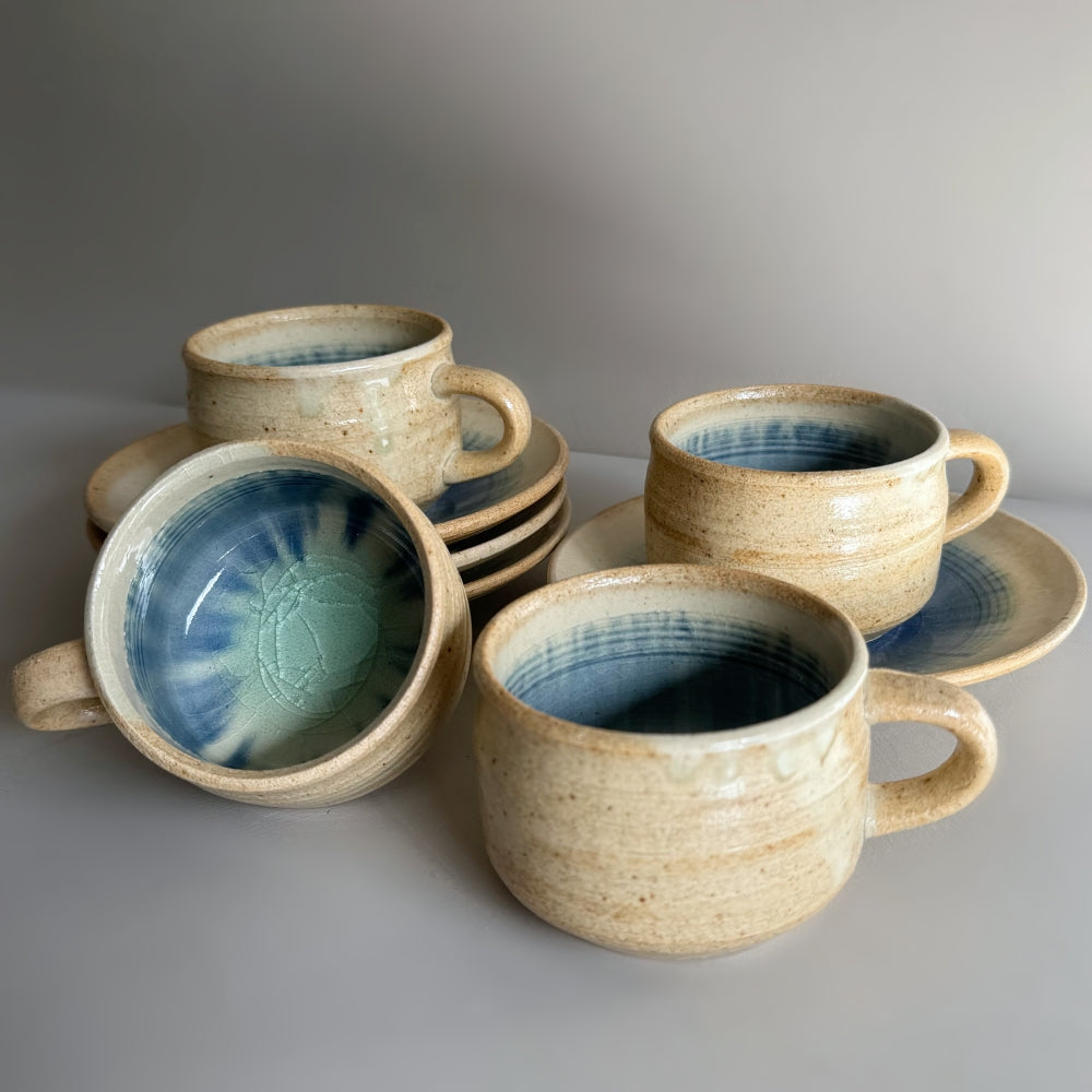 Sandy colour, blue glass glazed cup and saucer set. Handcrafted Japanese pottery, made in Japan. Available at Toka Ceramics.