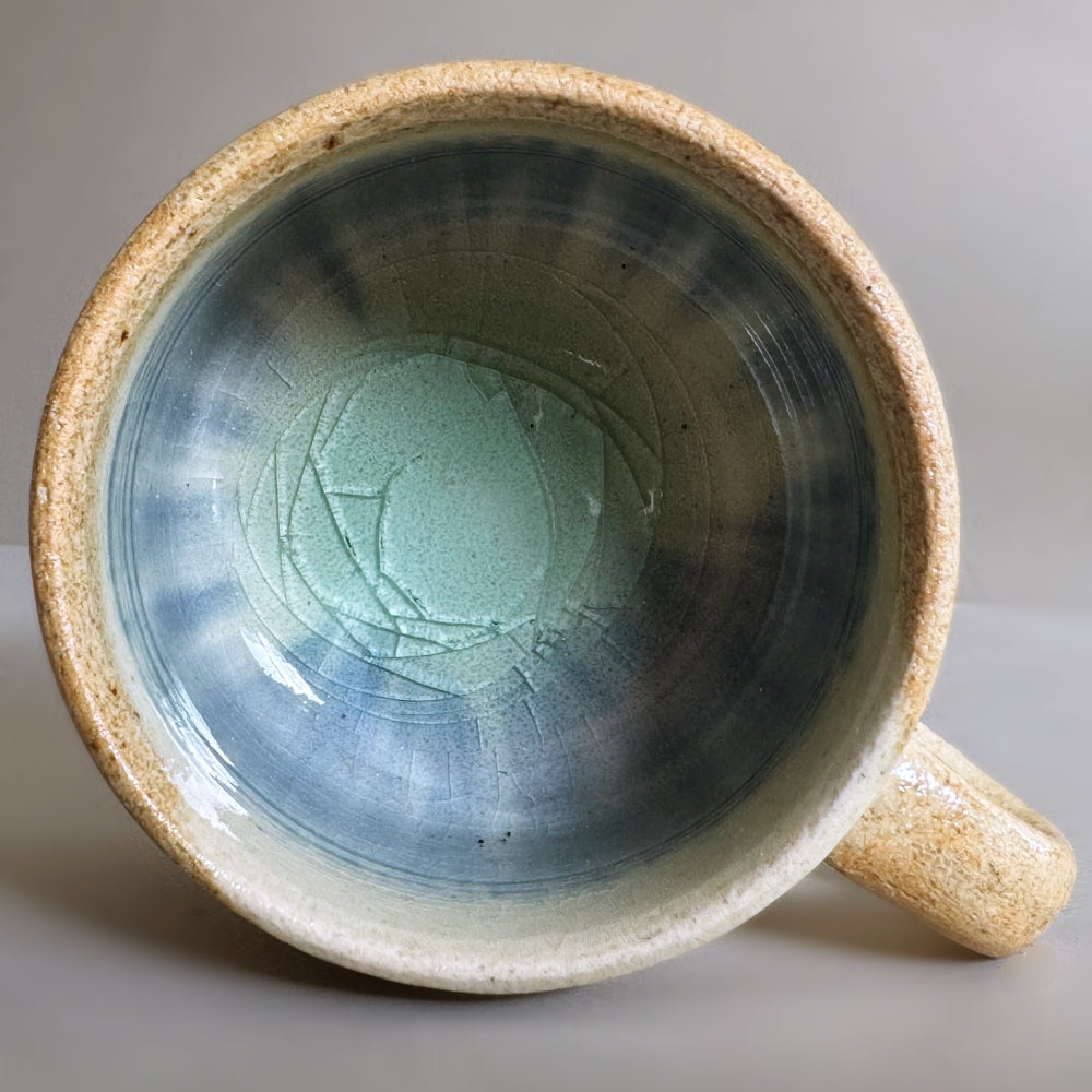 Sandy colour, blue glass glazed cup and saucer set. Handcrafted Japanese pottery, made in Japan. Available at Toka Ceramics.