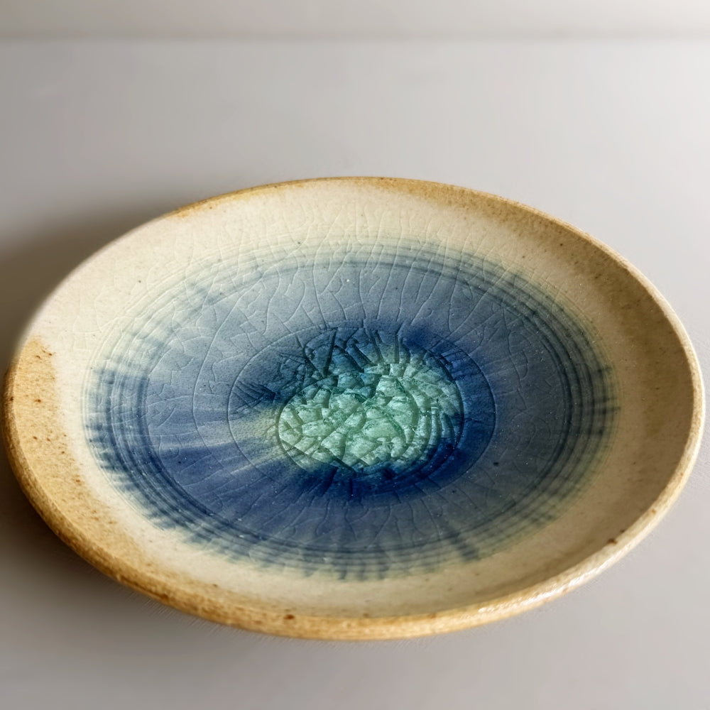 Sandy colour, blue glass glazed cup and saucer set. Handcrafted Japanese pottery, made in Japan. Available at Toka Ceramics.