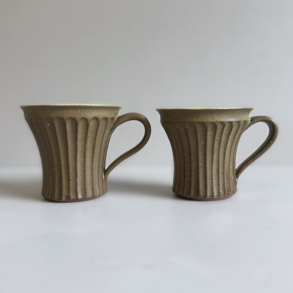 Japanese handcrafted pottery mug with shinogi pattern by Shoyo Gama. Available at Toka Ceramics.