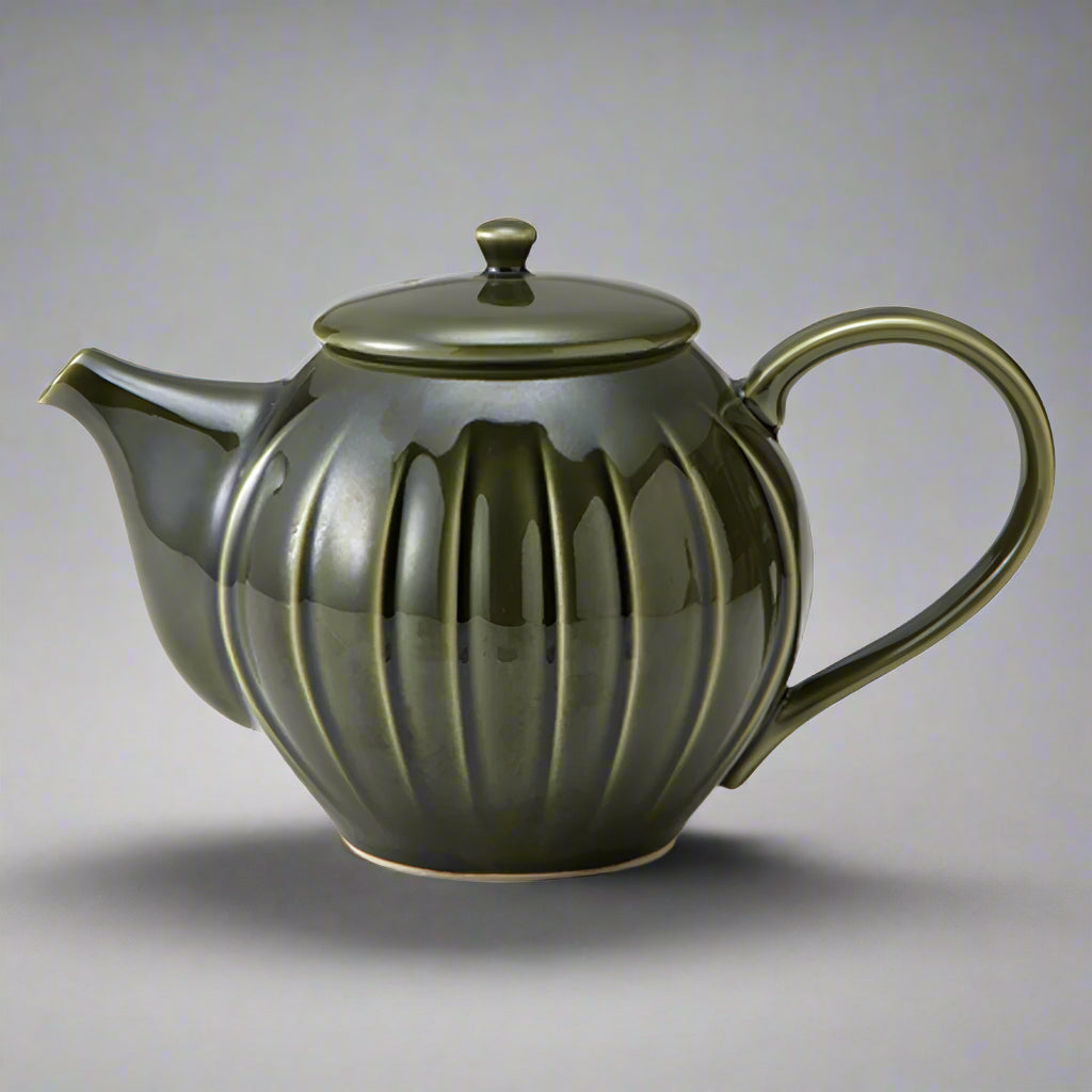 Shinogi Teapot in oribe green glaze, 750ml capacity. Mino ware, made in Japan. Available at Toka Ceramics.