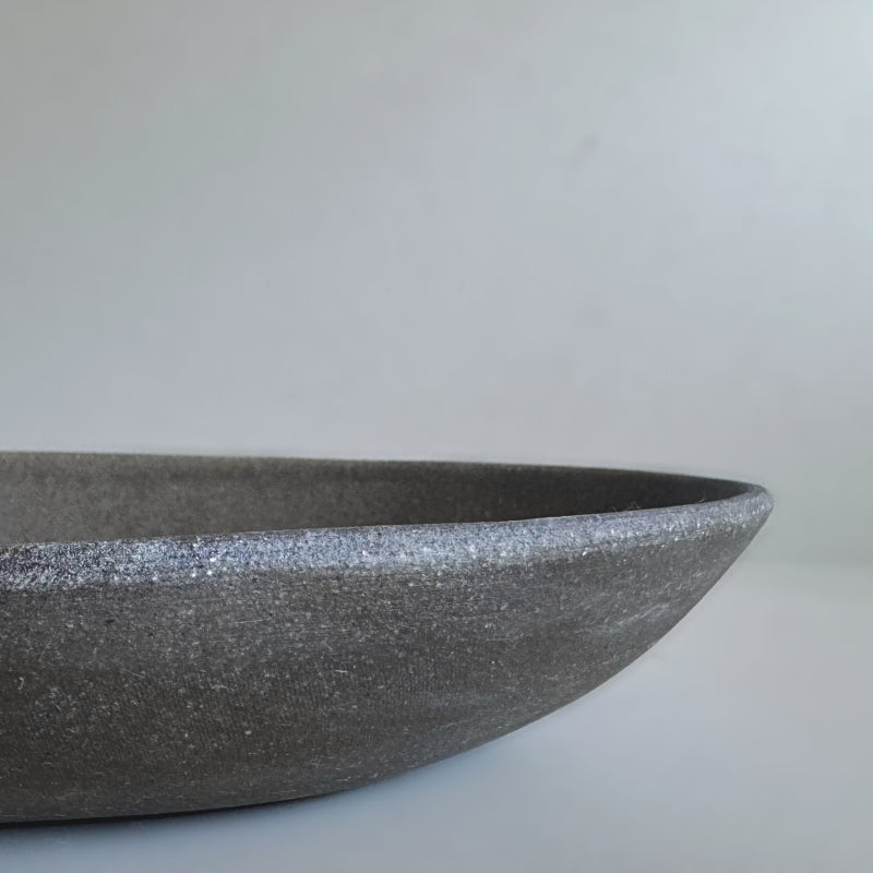 handcrafted Tsugaru Sueki Oval Shallow Bowls made in Japan, featuring a minimalist design with smooth, unglazed dark surfaces.