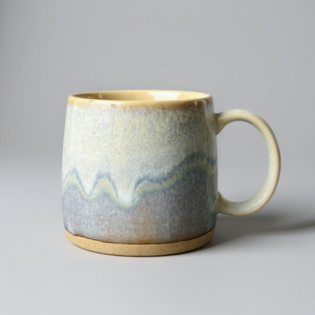 TOKA ceramic mug with a wavy reactive glaze in grey and cream, handmade Mino ware from Gifu, Japan.